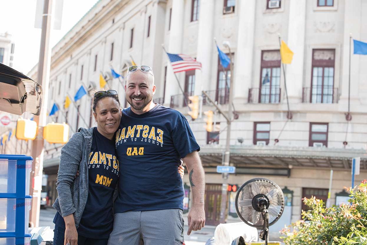 two parents wearing t-shirts that read EASTMAN MOM and EASTMAN DAD